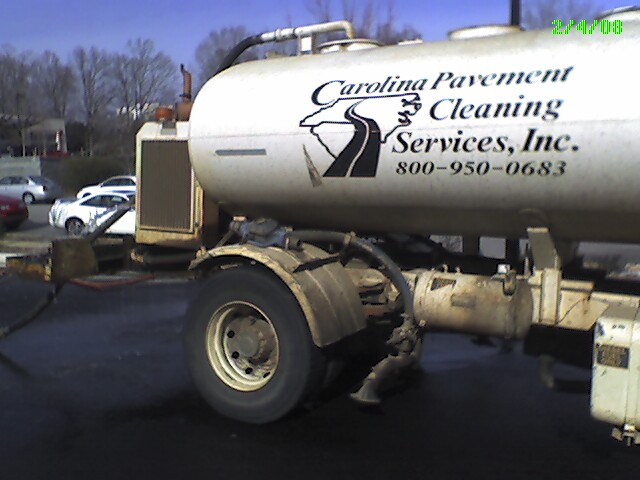 Water tanker belonging to Carolina Pavement Cleaning Services Inc. spewing water.
