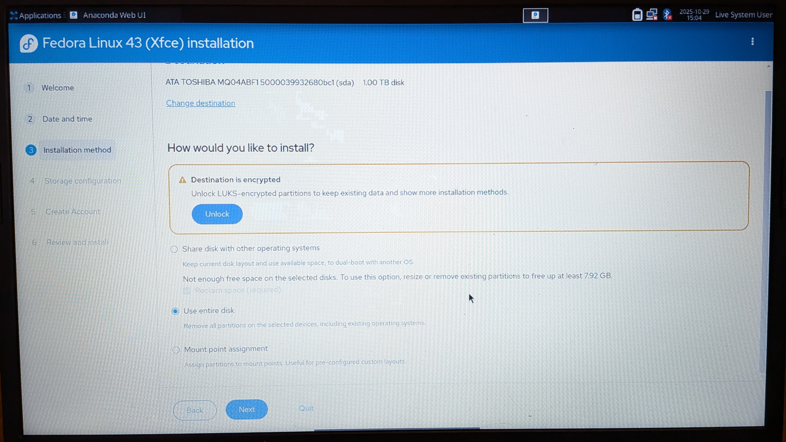 Fedora 43 Xfce installer, asking how would you like to install; the "use entire dist" button is checked