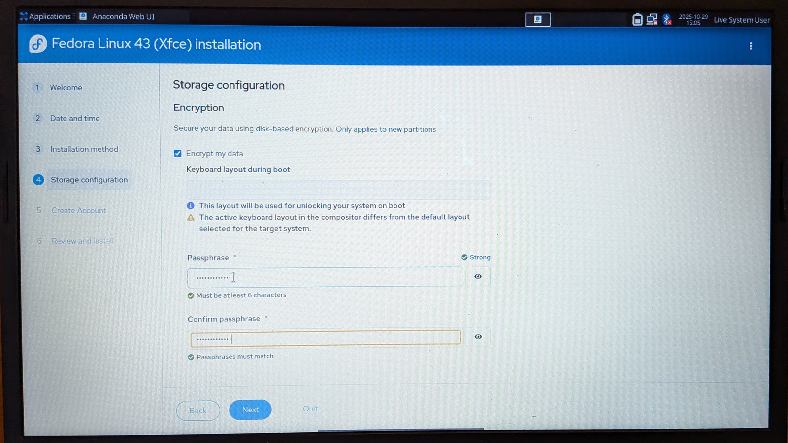 Fedora 43 Xfce installer, prompting for storage configuration and a button that says "encrypt my data"
