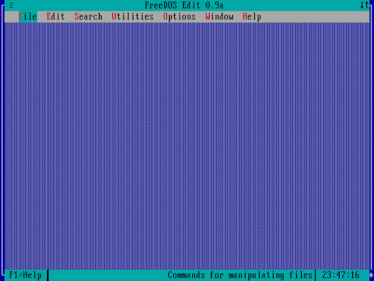 The FreeDOS editor without any windows open, the File menu is selected