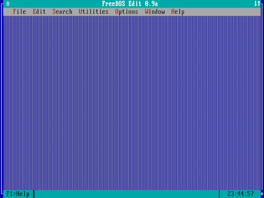The FreeDOS editor without any windows open, it is an empty screen with a menu at the top