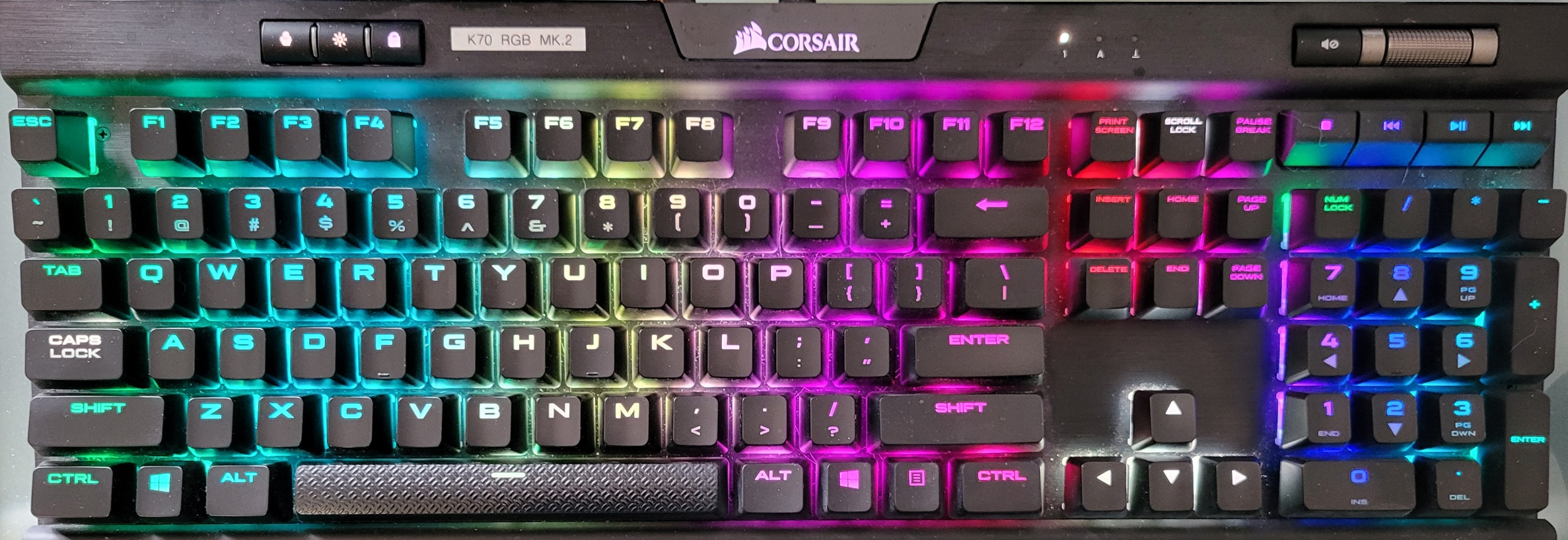 Corsair K70 RGB MK2 keyboard with RGB light patterns.
