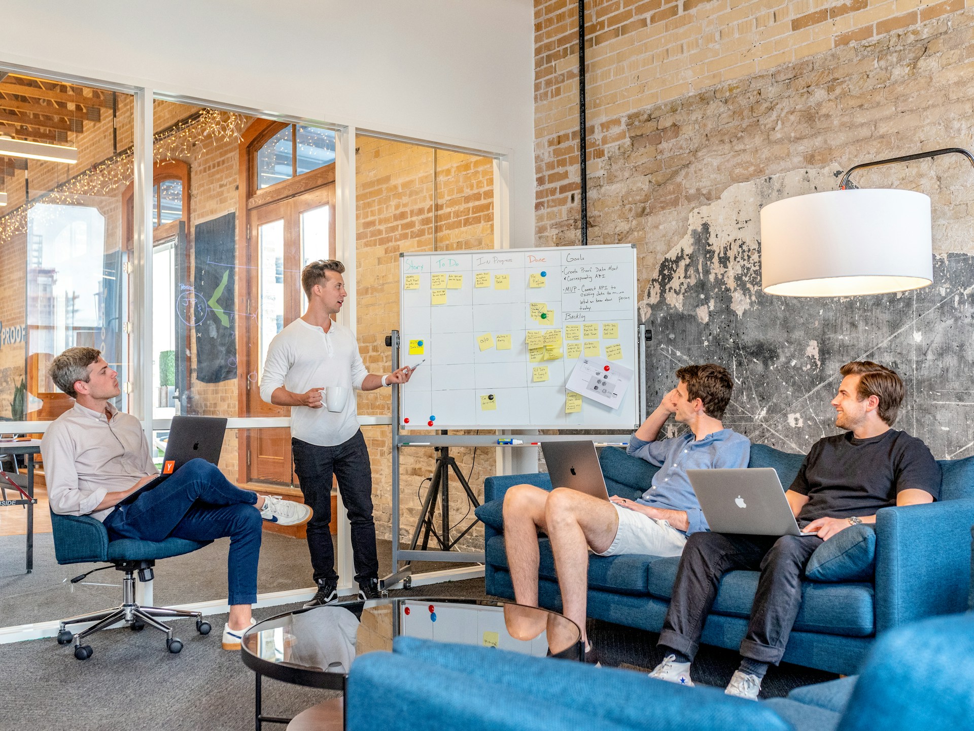 Developers looking at a whiteboard to plan their roadmap.